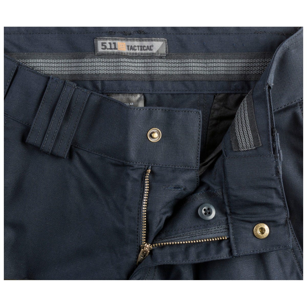 Navy blue tactical pants with visible 5.11 Tactical branding on a white background